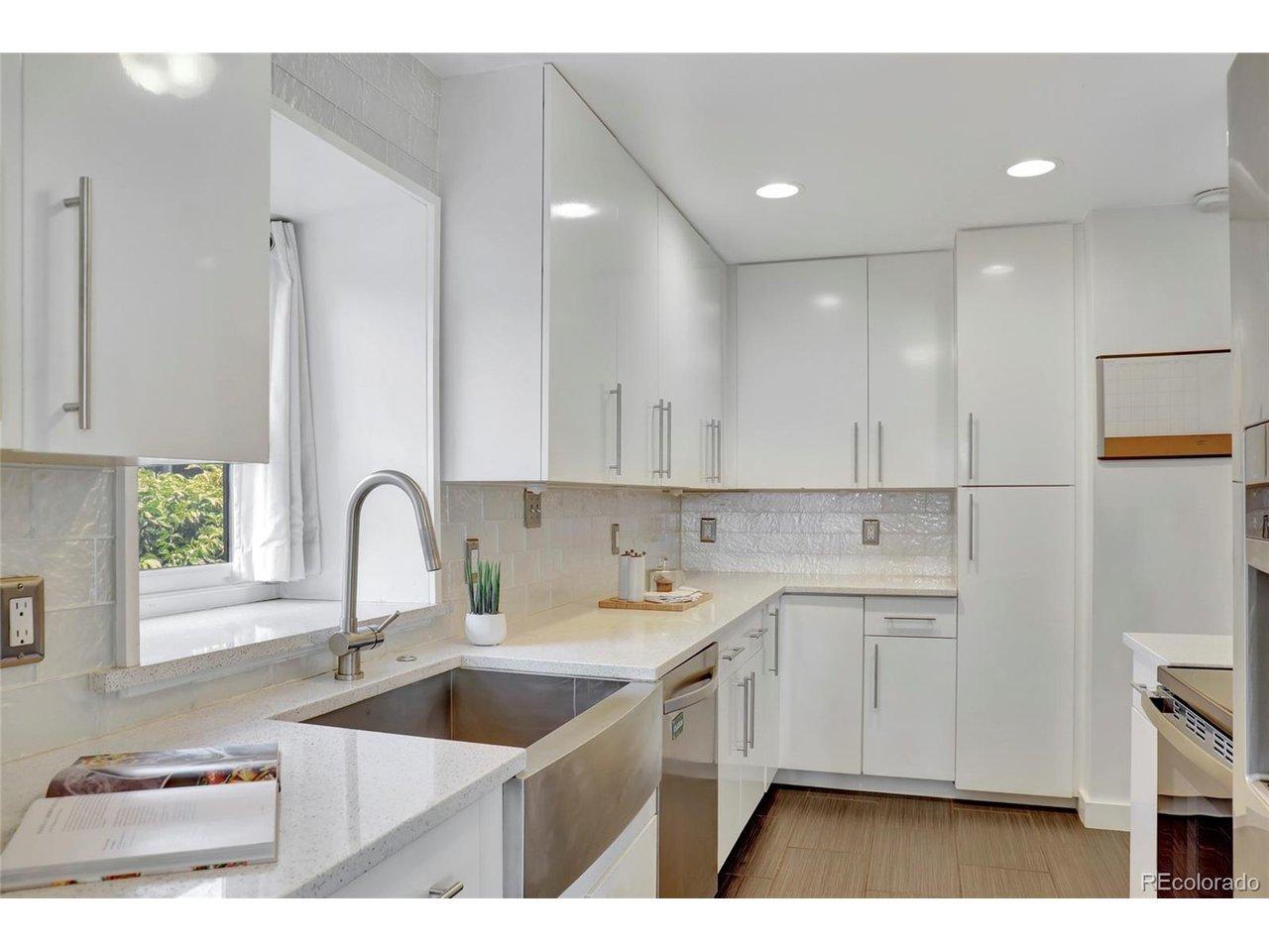 Image 1: Updated kitchen featuring quartz countertops, modern cabinetry, stainless steel appliances, and abundant storage. Image 1: Updated kitchen featuring quartz countertops, modern cabinetry, stainless steel appliances, and abundant storage.