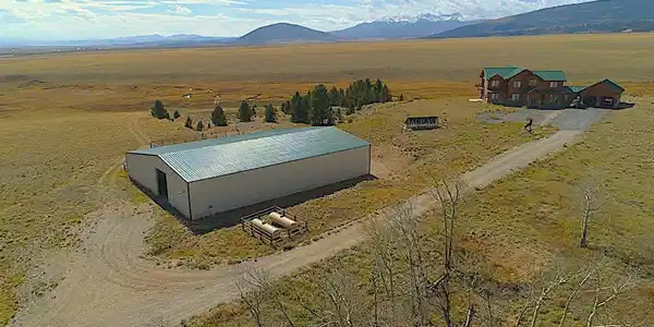 Image 4: Summer view of barn and home