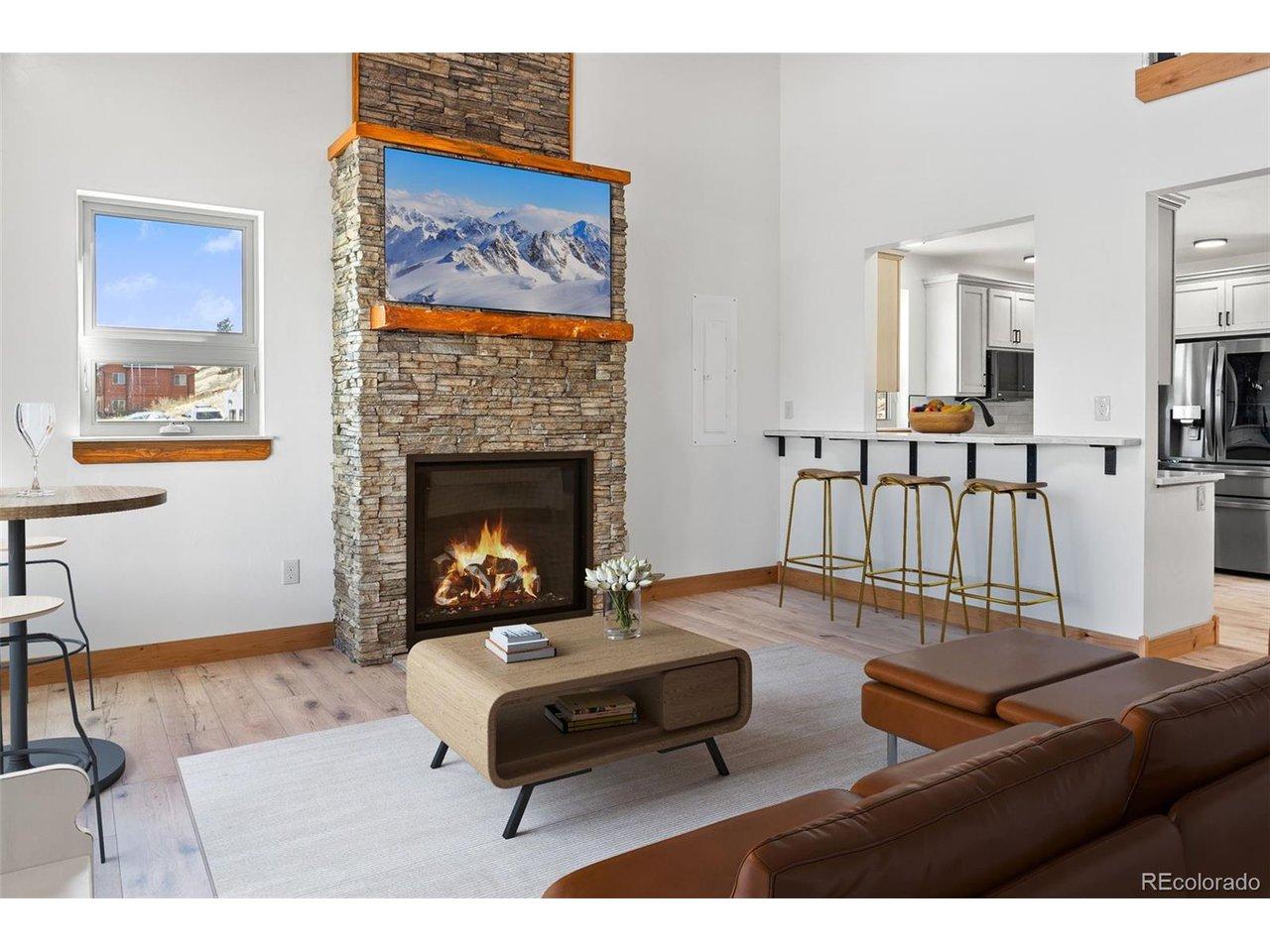 Image 4: Virtually Staged Great Room with convenient bar seating