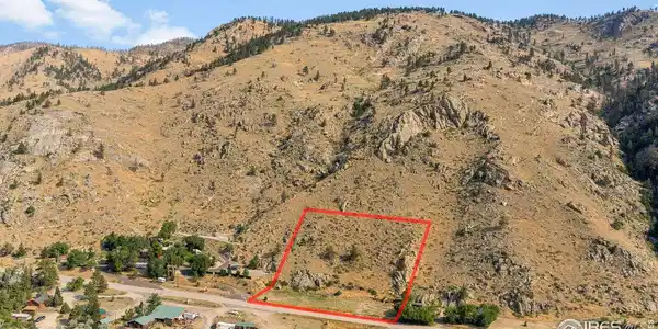 Image 2: Sweeping aerial view highlights the property's position within a striking canyon landscape surrounded by rocky ridges and pine-dotted hillsides. Image 2: Sweeping aerial view highlights the property's position within a striking canyon landscape surrounded by rocky ridges and pine-dotted hillsides.