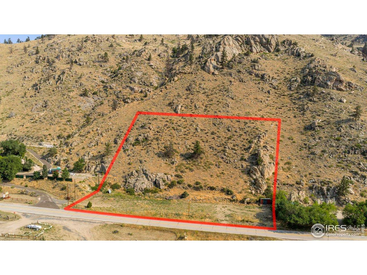 Image 3: Defined boundaries show a mix of level ground near the roadway and elevated terrain, offering multiple potential build sites with panoramic views. Image 3: Defined boundaries show a mix of level ground near the roadway and elevated terrain, offering multiple potential build sites with panoramic views.