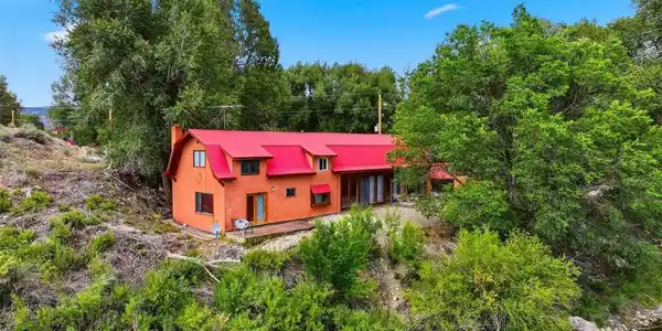 Image 2: Back of the house immediately adjacent to the Arkansas River