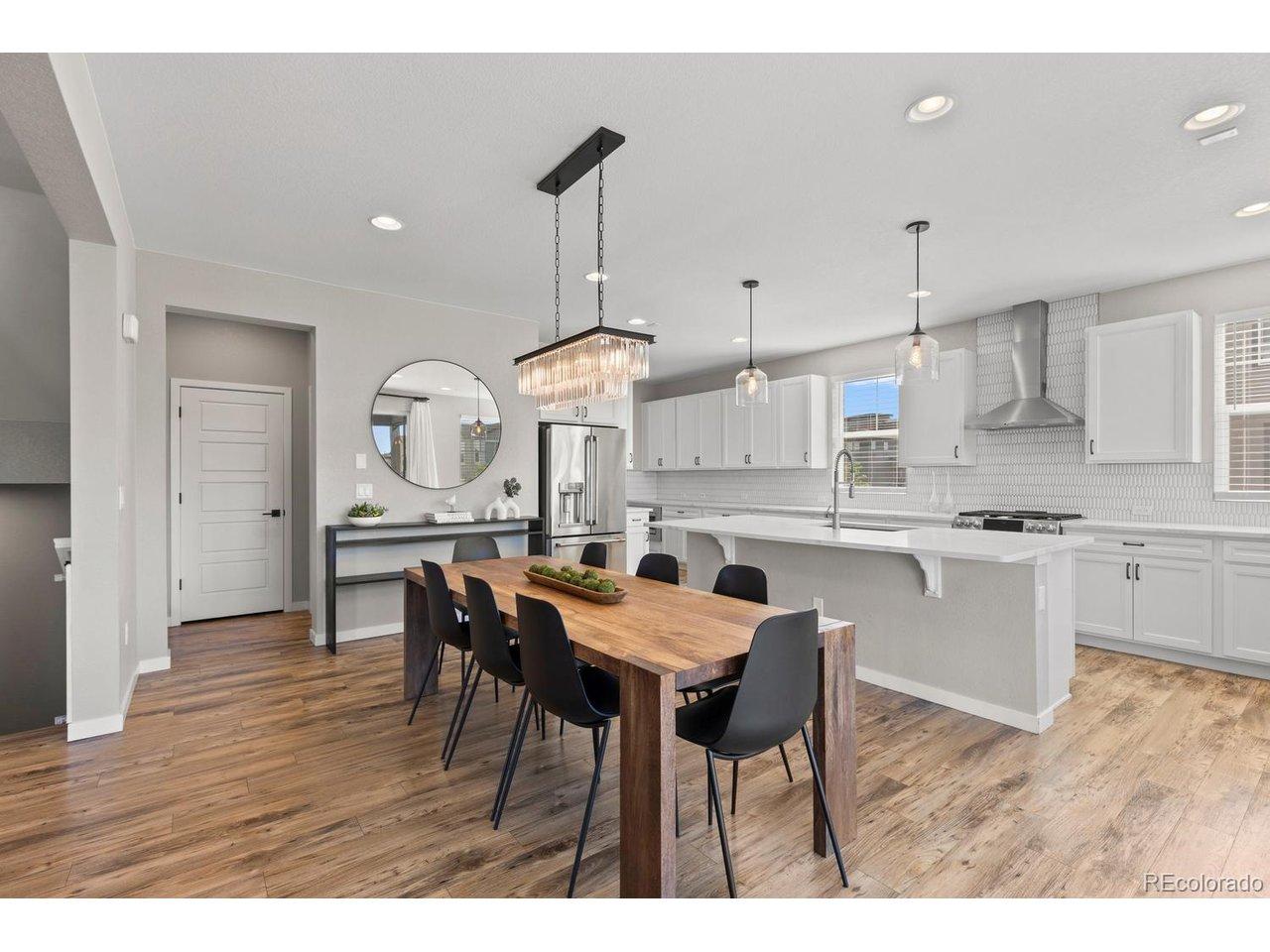 Image 4: Open dining room with designer lighting Image 4: Open dining room with designer lighting