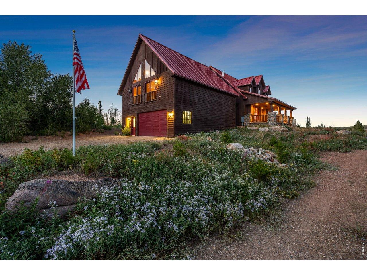 Image 2: American flag at 9000 FT and entry to the 4-car garage