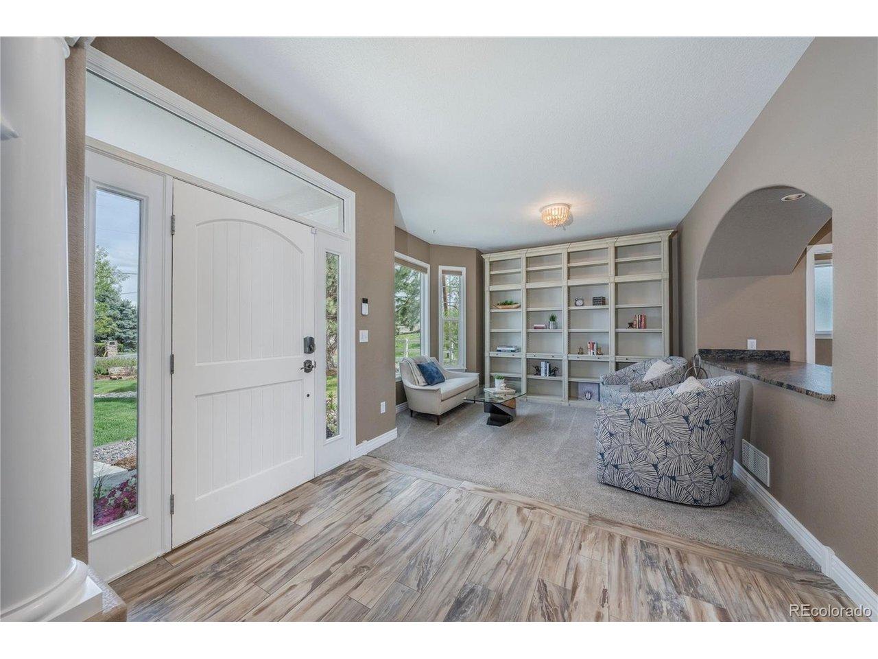 Image 4: Entry with flex space living, reading, or music Image 4: Entry with flex space living, reading, or music