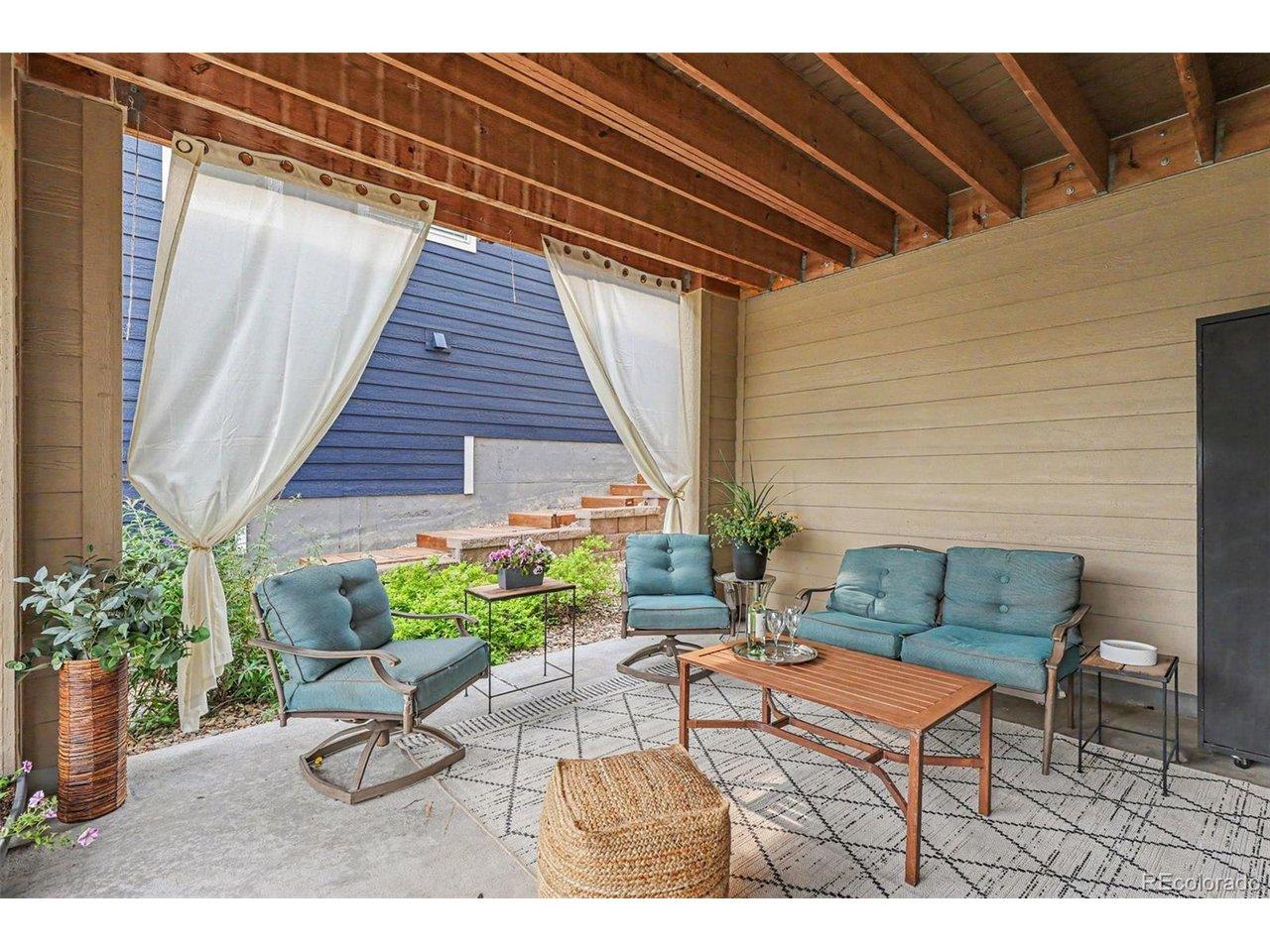 Image 3: Welcoming covered patio outside walk-out basement Image 3: Welcoming covered patio outside walk-out basement