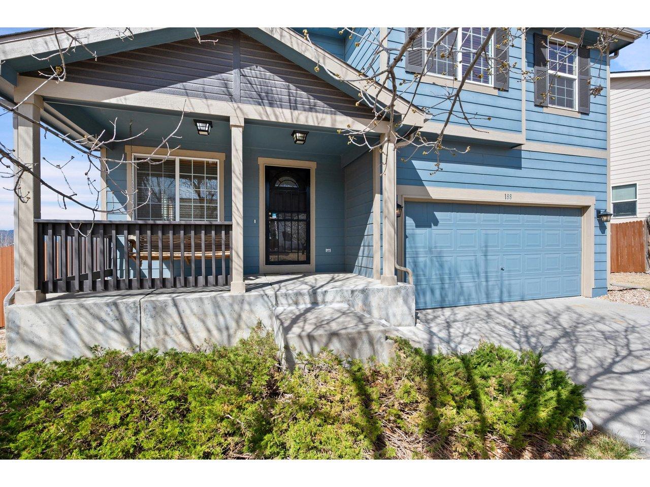 Image 2: Covered front porch with a swing. Image 2: Covered front porch with a swing.