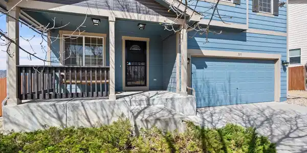 Image 2: Covered front porch with a swing.