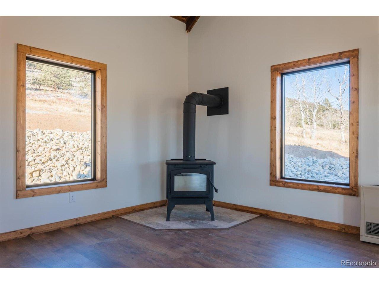 Image 3: Main living area with optional wood burning stove Image 3: Main living area with optional wood burning stove