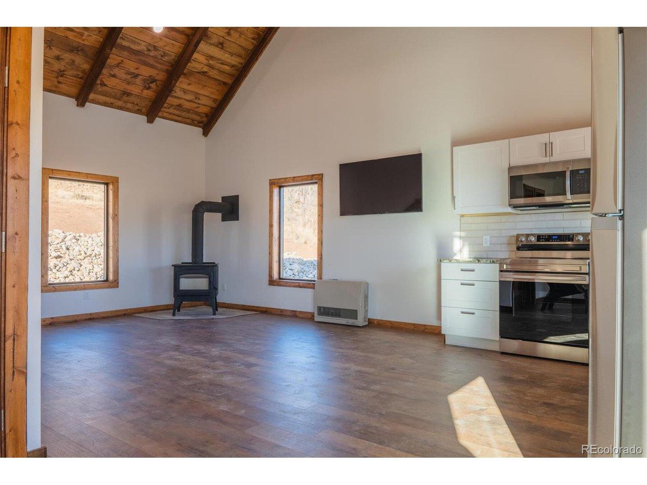 Image 4: Main living area with optional wood burning stove Image 4: Main living area with optional wood burning stove
