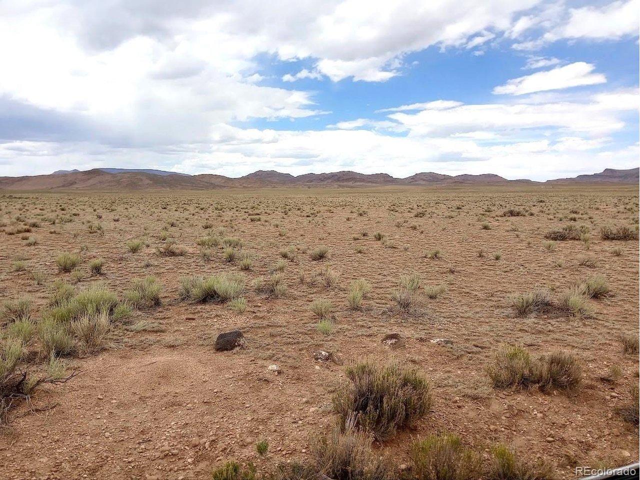 Image 2: Large volcanic rock is the approx coener of property