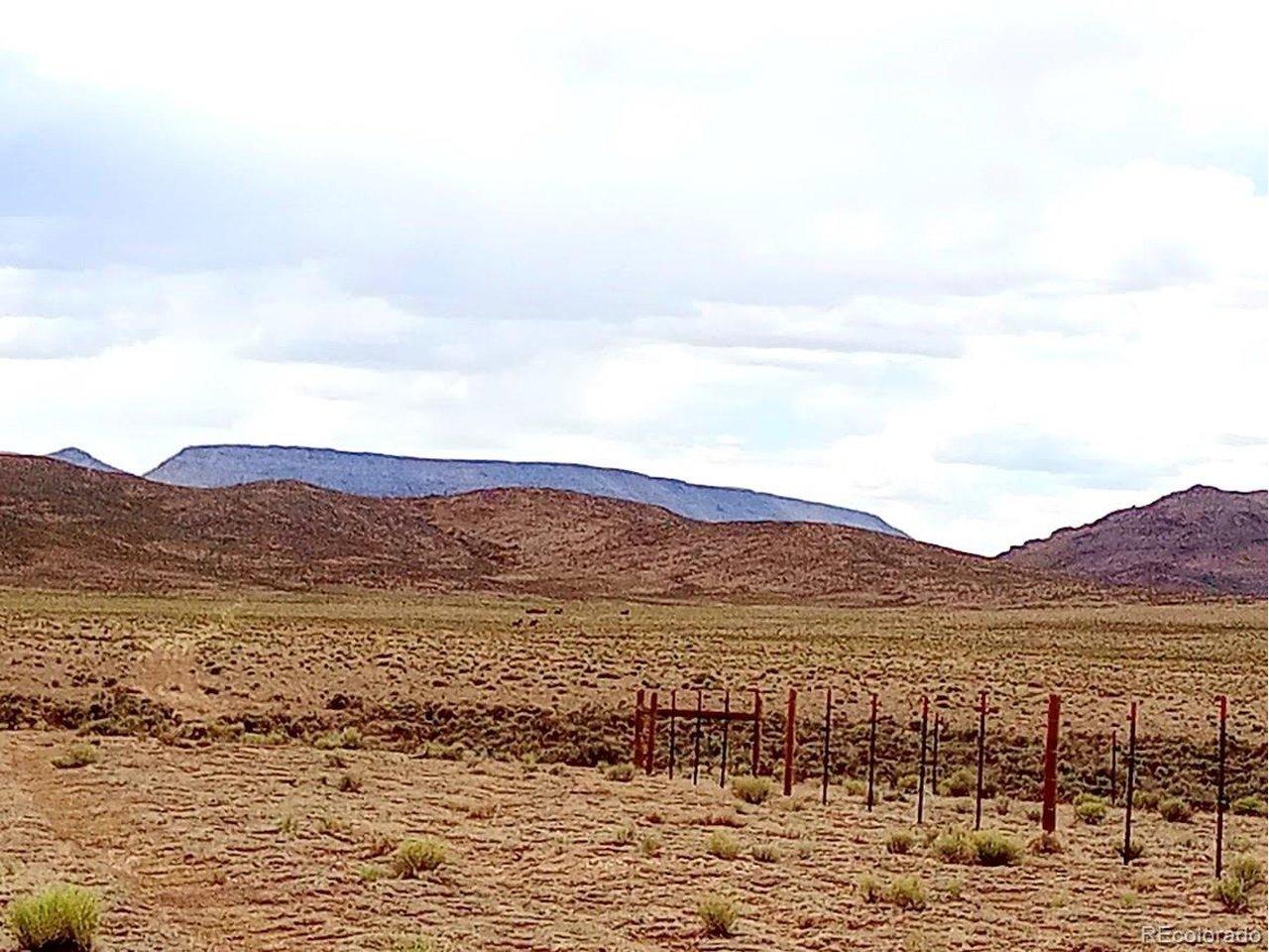 Image 3: property to the left (south) of the fence