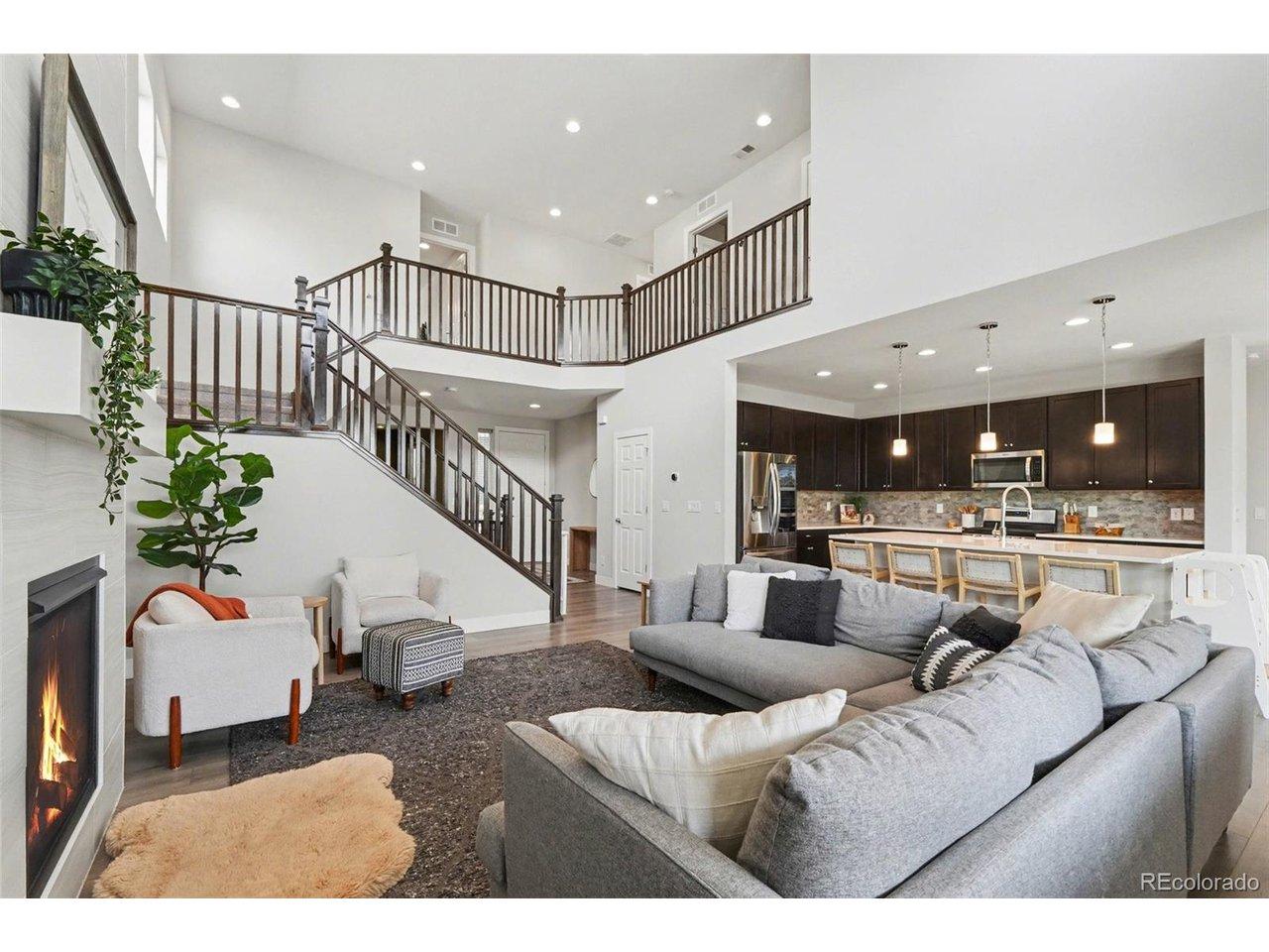 Image 1: Bright and open living space with vaulted ceilings and large windows Image 1: Bright and open living space with vaulted ceilings and large windows