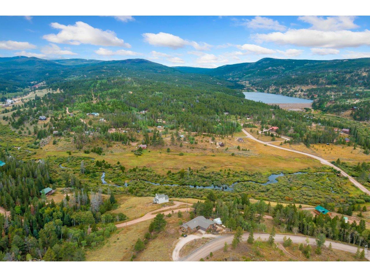 Image 1: Crystal lake is visible in the distance. Image 1: Crystal lake is visible in the distance.