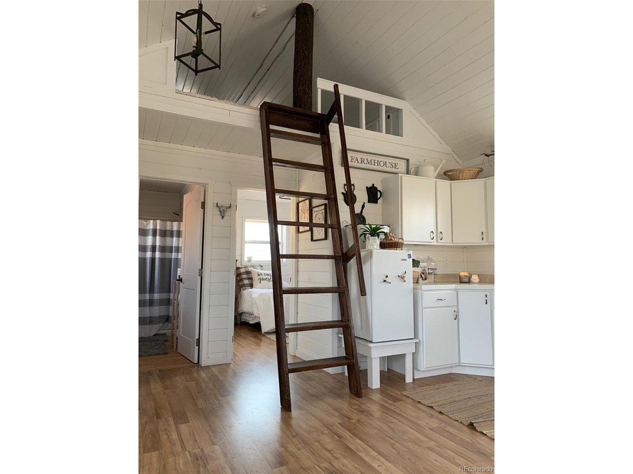 Image 4: Ladder to the loft with main bedroom and bathroom behind. Image 4: Ladder to the loft with main bedroom and bathroom behind.