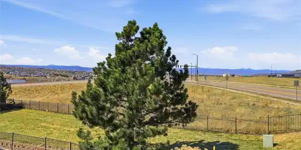 Image 2: Deck with a peaceful outlook over the open greenbelt.