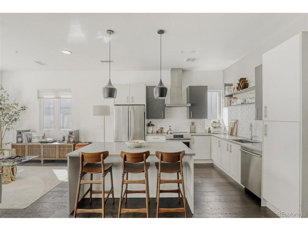 Image 1: Gourmet Kitchen: Quartz Counters, Bosch Appliances, Oversized Island + Ample Storage