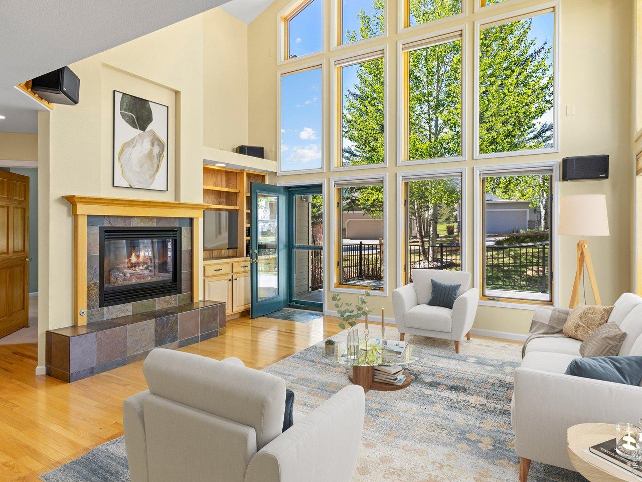 Image 2: Wall of windows and warm fireplace
