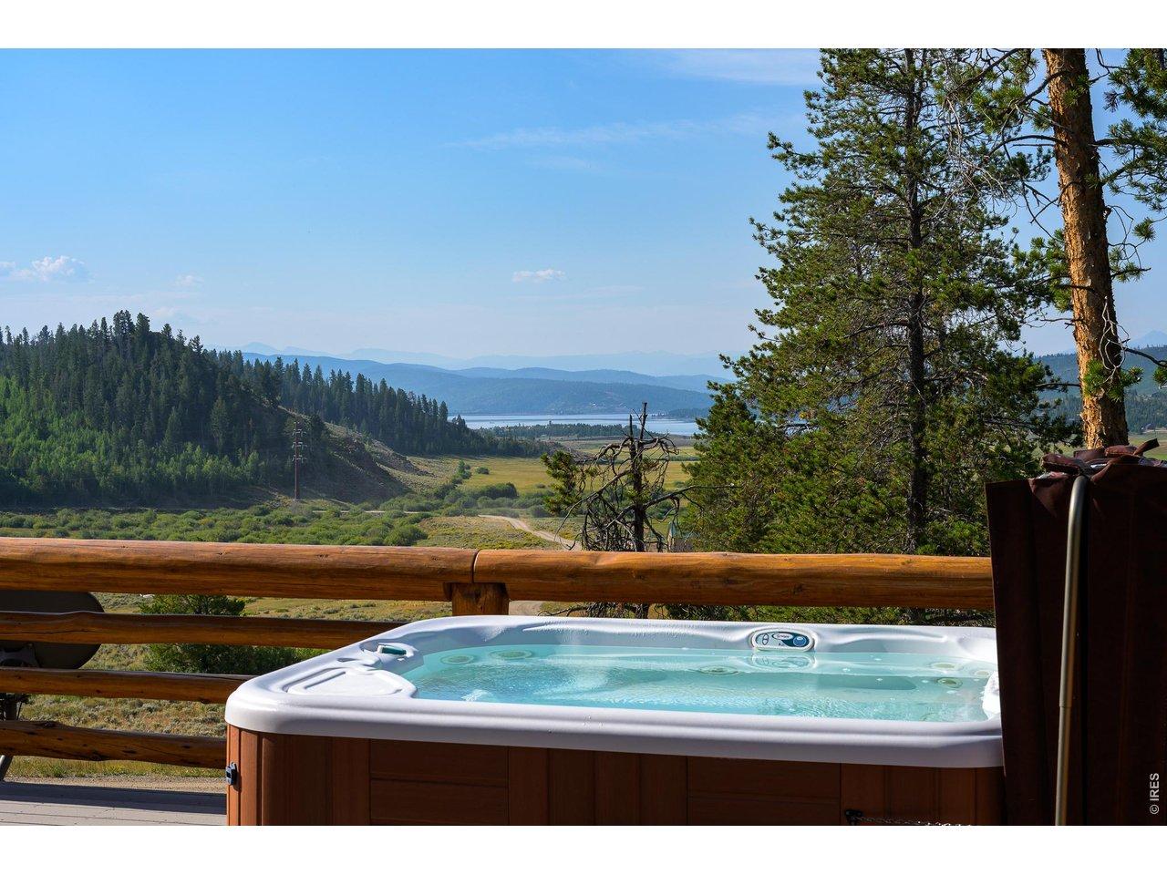 Image 4: Enjoy the mountain and lake views from the hot tub after a day of outdoor adventures. Image 4: Enjoy the mountain and lake views from the hot tub after a day of outdoor adventures.