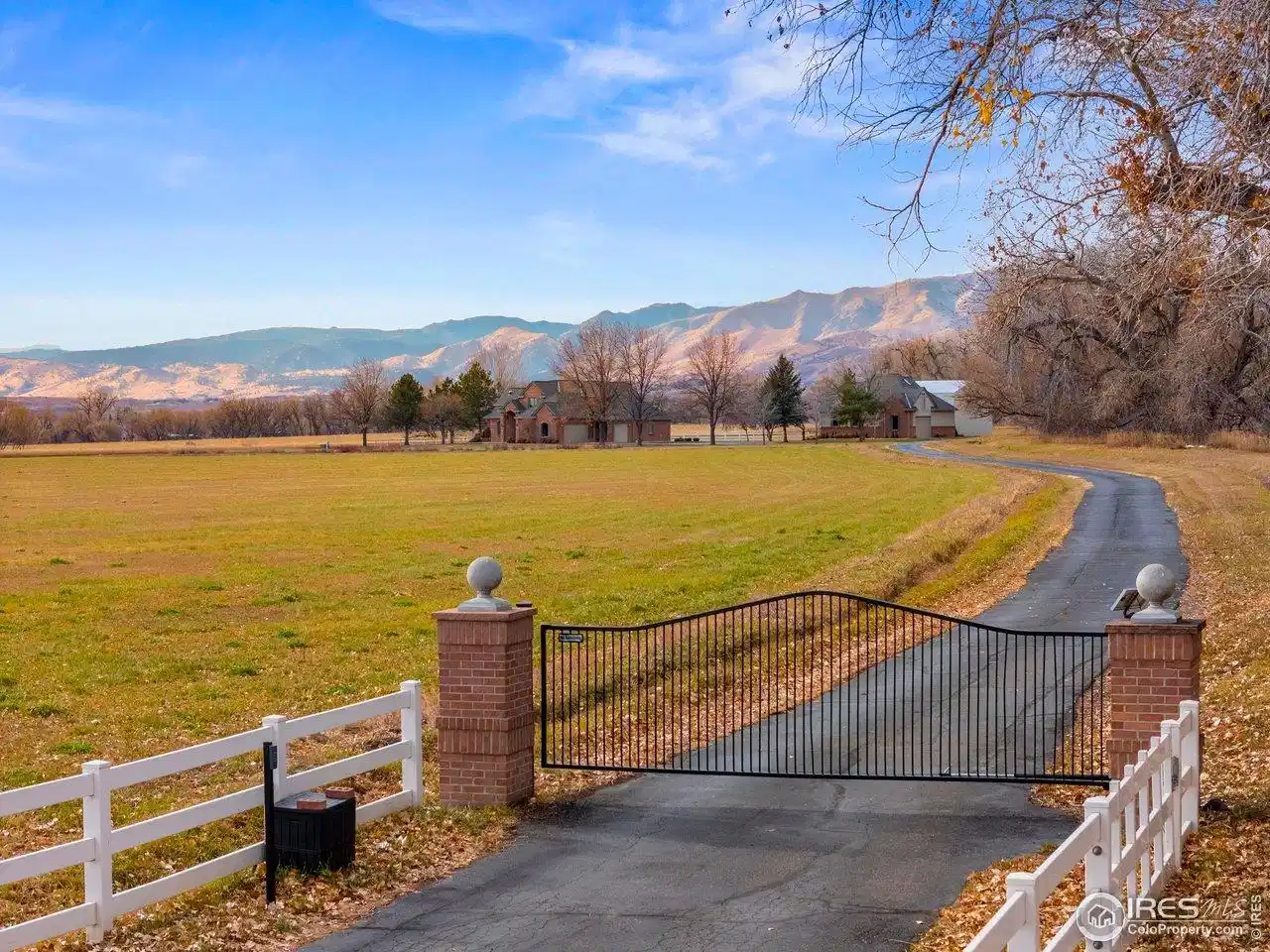 Image 1: Gated Security Entrance with a Majestic Foothills Backdrop!
