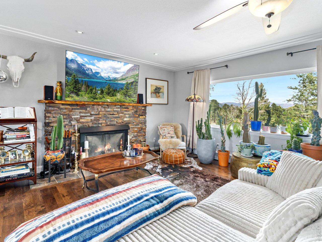 Image 4: This four-bedroom, three-bathroom property features a bright, open main-level floor plan with hickory flooring throughout Image 4: This four-bedroom, three-bathroom property features a bright, open main-level floor plan with hickory flooring throughout