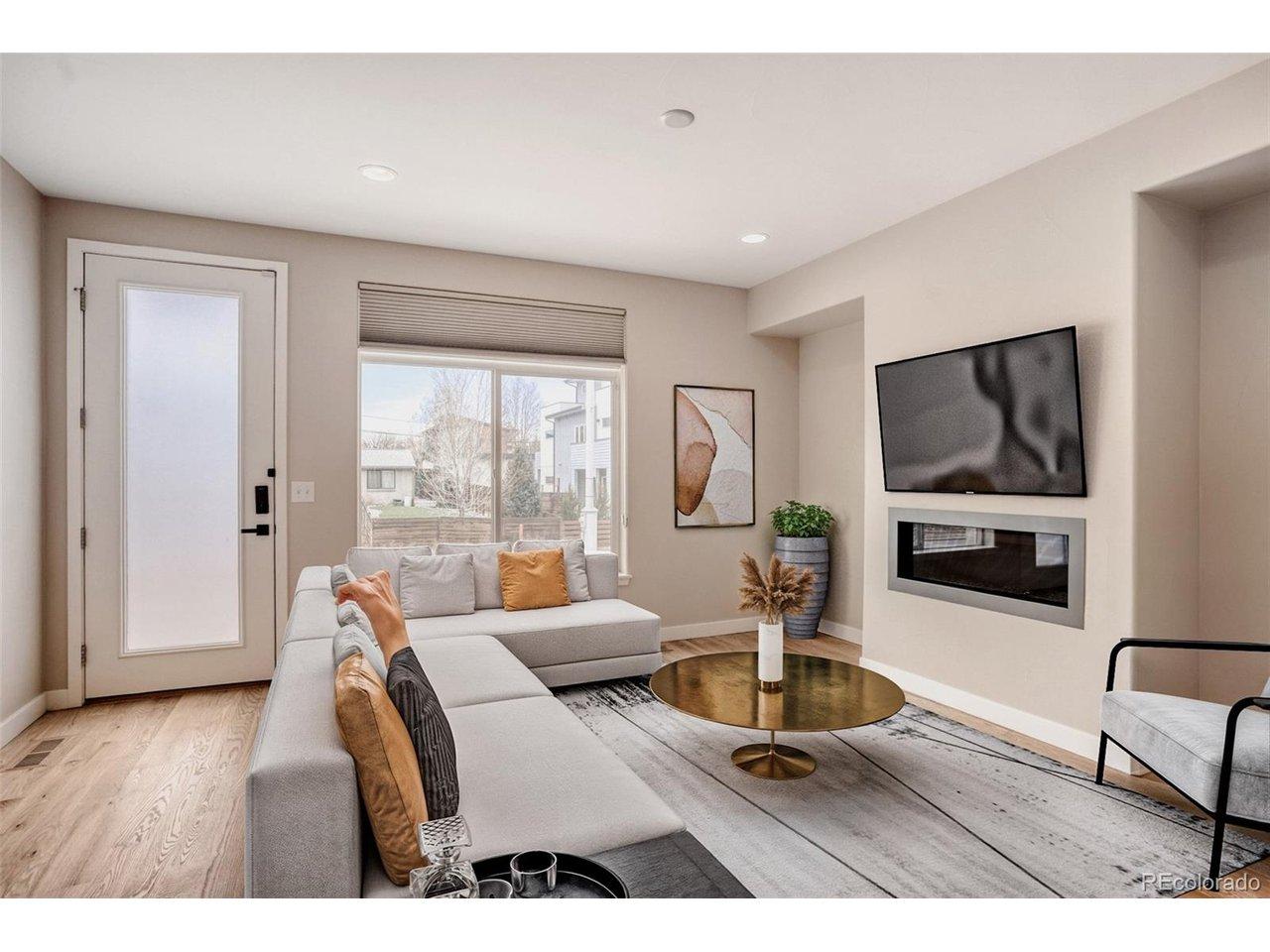 Image 1: Open living space with tons of natural light, gas fireplace & more (virtually staged) Image 1: Open living space with tons of natural light, gas fireplace & more (virtually staged)