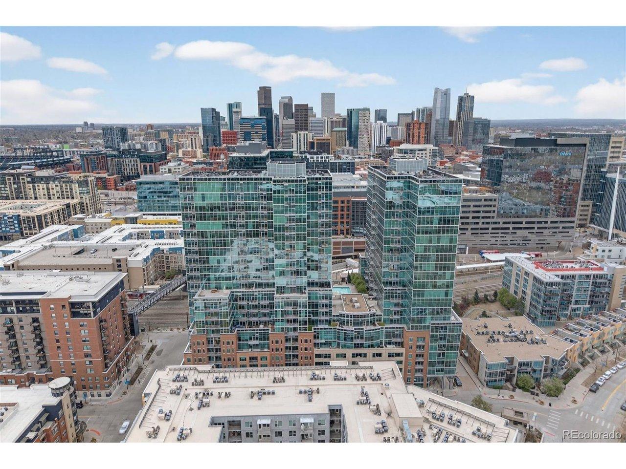Image 1: The Iconic Glass House frames the Denver Skyline. Image 1: The Iconic Glass House frames the Denver Skyline.