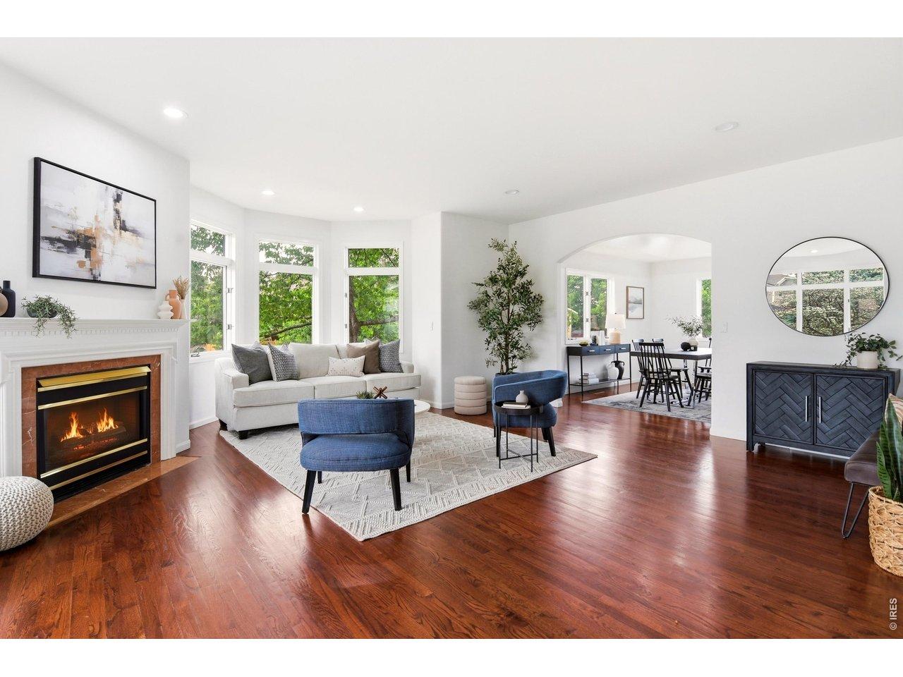 Image 2: Entry living room with gas fireplace