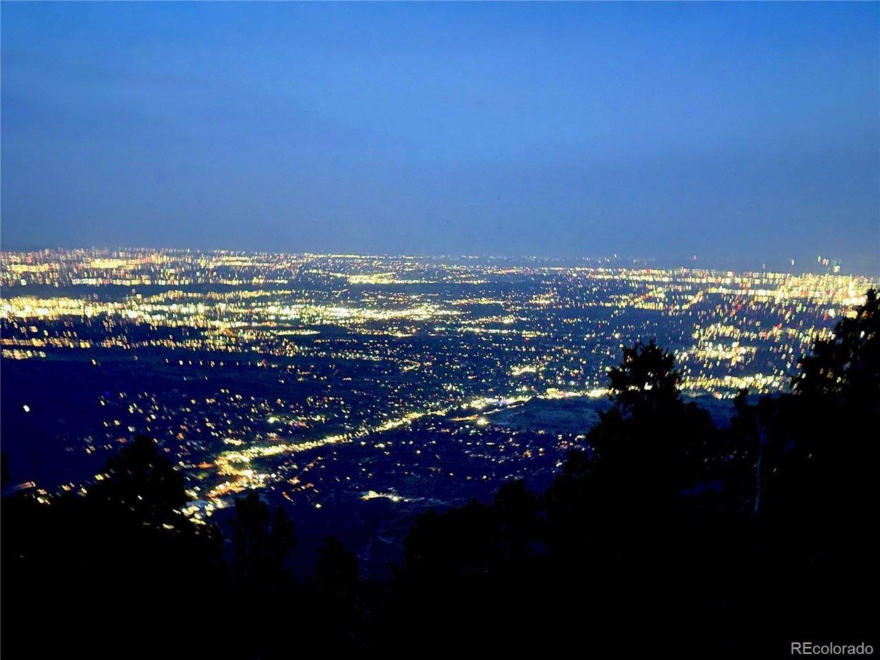Image 2: View of the city lights at night from the lot Image 2: View of the city lights at night from the lot