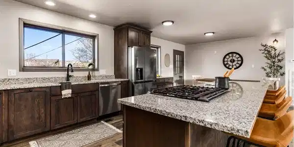 Image 4: Gourmet kitchen with granite counter tops, island, custom cabinets and LTV flooring Image 4: Gourmet kitchen with granite counter tops, island, custom cabinets and LTV flooring