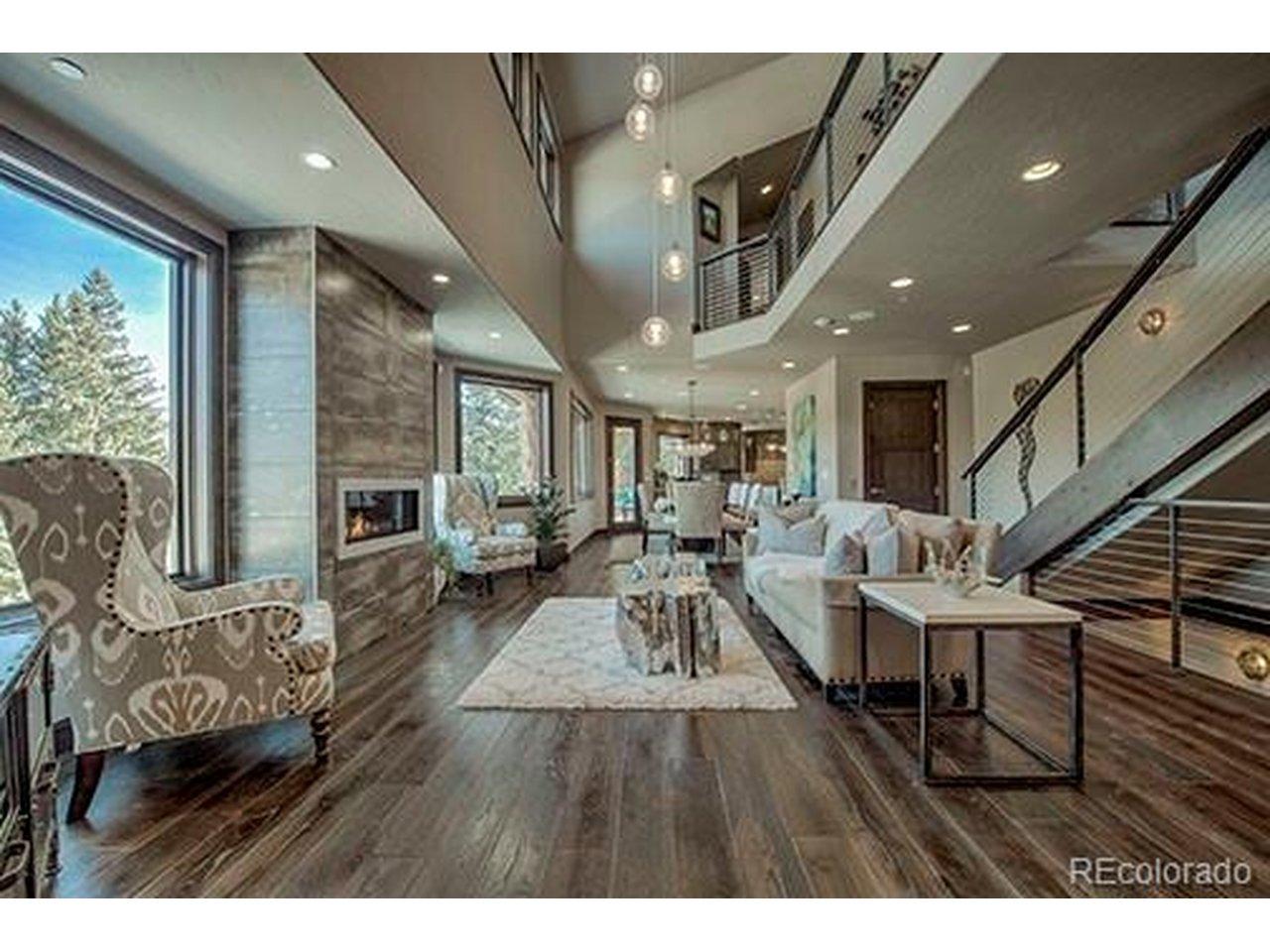 Image 3: Elegant gathering space anchored by a gas fireplace,designed for both intimate evenings and grandentertaining.