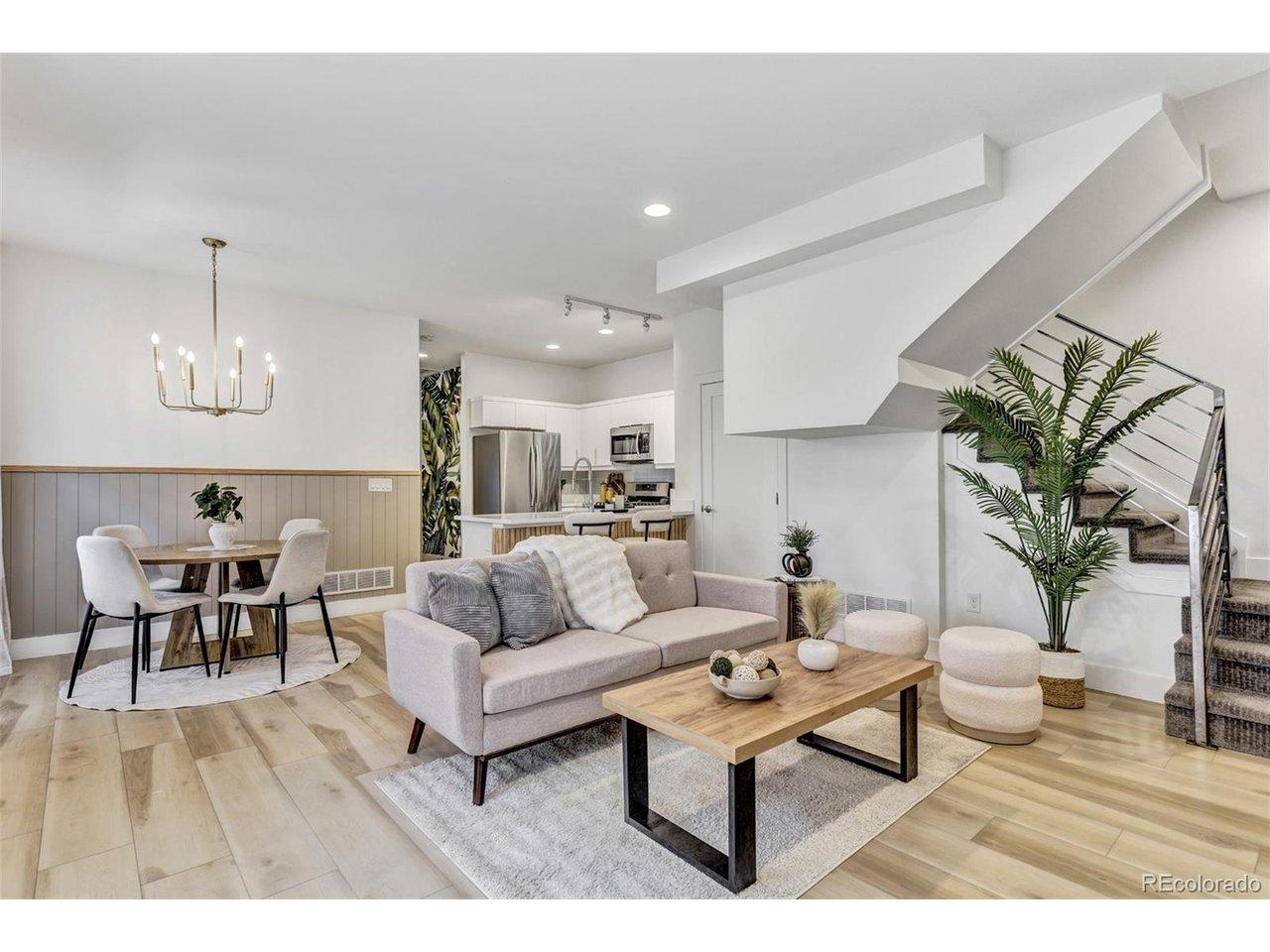Image 2: Bright, open living area with 9 ft ceilings, wide-plank flooring, and designer lighting. Image 2: Bright, open living area with 9 ft ceilings, wide-plank flooring, and designer lighting.