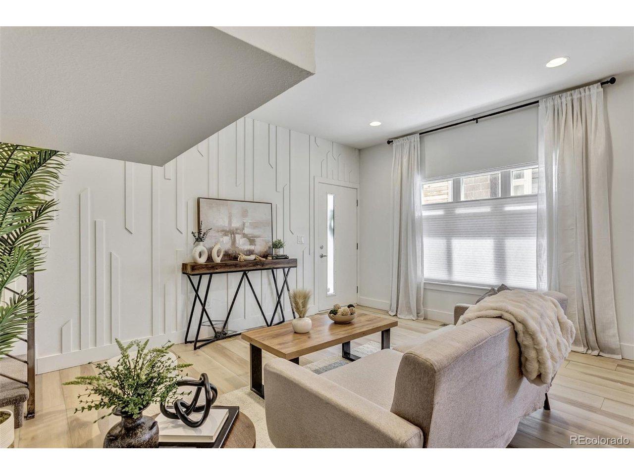 Image 4: Living and dining flow with large windows and modern finishes throughout the main level. Image 4: Living and dining flow with large windows and modern finishes throughout the main level.