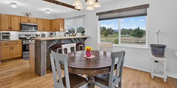 Image 3: Dining area and kitchen wit views Image 3: Dining area and kitchen wit views