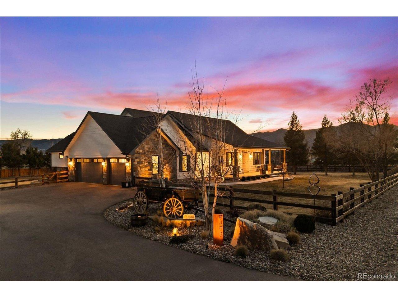 Image 1: A Colorado dream home, glowing under a breathtaking twilight sky-welcome home!
