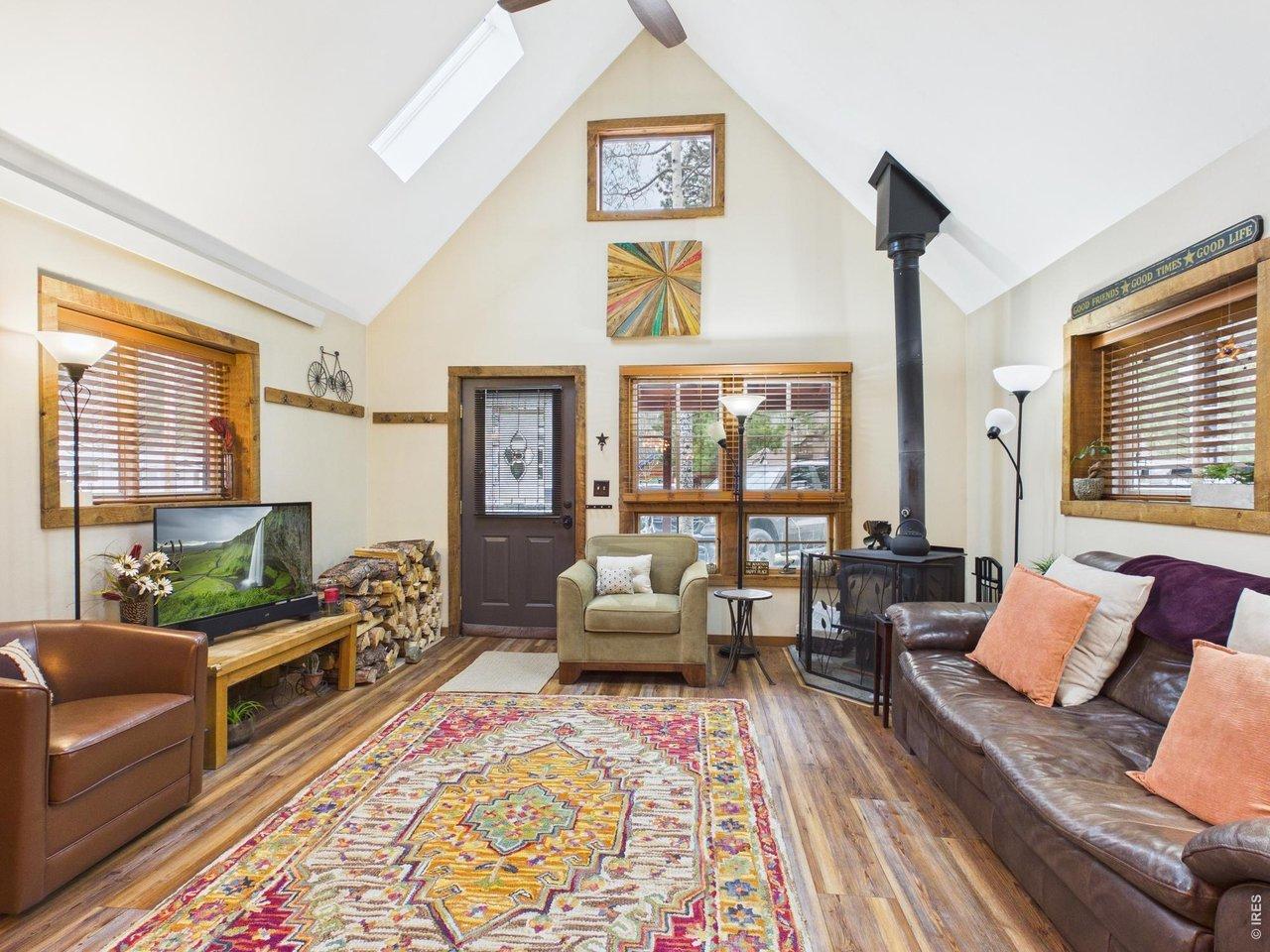 Image 4: Spacious vaulted Great Room, woodstove, wood windows, skylights. Image 4: Spacious vaulted Great Room, woodstove, wood windows, skylights.