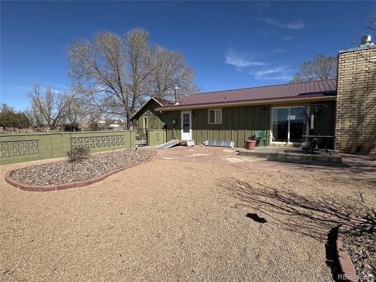 Image 3: Natural landscape & decorative fence encompasses a private yard area behind the home. Image 3: Natural landscape & decorative fence encompasses a private yard area behind the home.