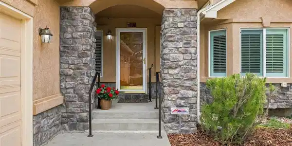 Image 3: Covered and welcoming front porch with sitting nook creating a quiet spot for enjoying the afternoon sunsets. Image 3: Covered and welcoming front porch with sitting nook creating a quiet spot for enjoying the afternoon sunsets.