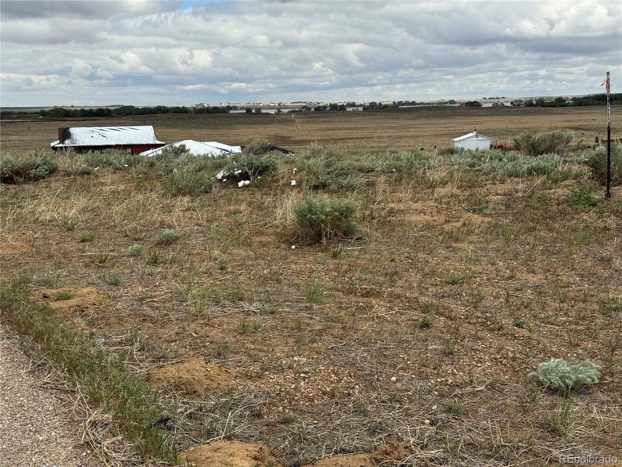 Image 3: at south property line looking north west on property lake in distance Image 3: at south property line looking north west on property lake in distance