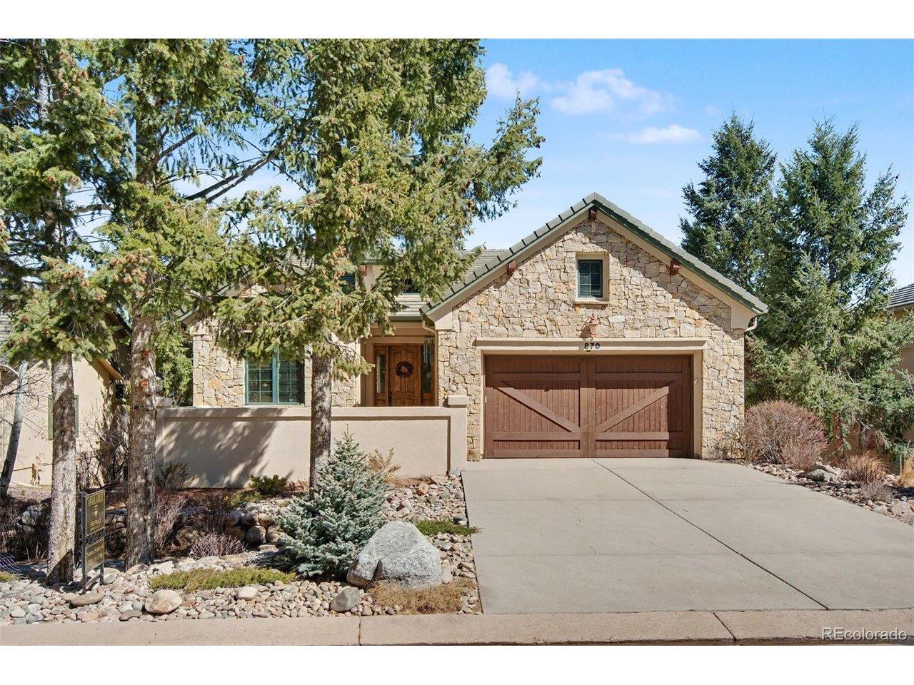 Image 1: Arrive home to timeless architecture and the inviting charm of your private front courtyard. Stucco and stone exterior with a concrete tile roof.