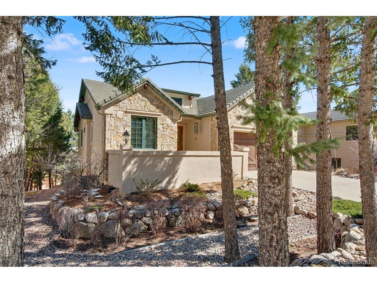 Image 3: Enjoy the front courtyard, surrounded by trees and views of the foothills