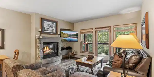 Image 4: Natural light pours in through oversized windows, framing mountain views right from the comfort of the couch. Image 4: Natural light pours in through oversized windows, framing mountain views right from the comfort of the couch.