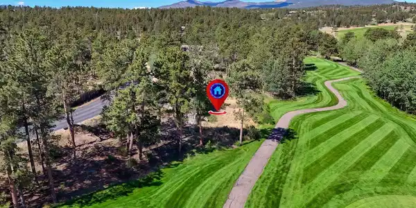 Image 3: Aerial view looking down the 10th fairway west toward the 10th green with Bald Mountain in the distance. Image 3: Aerial view looking down the 10th fairway west toward the 10th green with Bald Mountain in the distance.