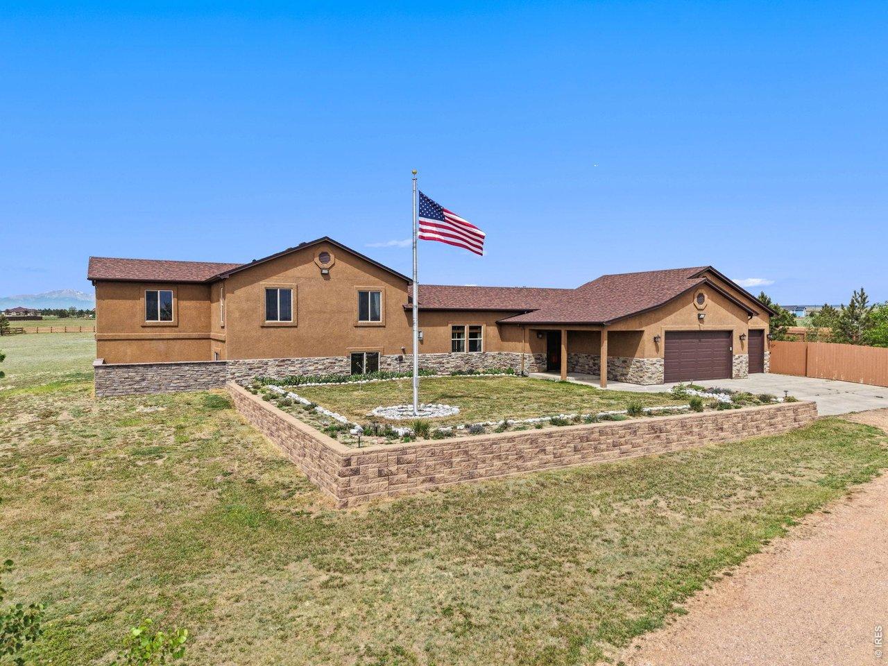 Image 4: Front of home faces East, 888 sf attached garage, lighted flagpole Image 4: Front of home faces East, 888 sf attached garage, lighted flagpole