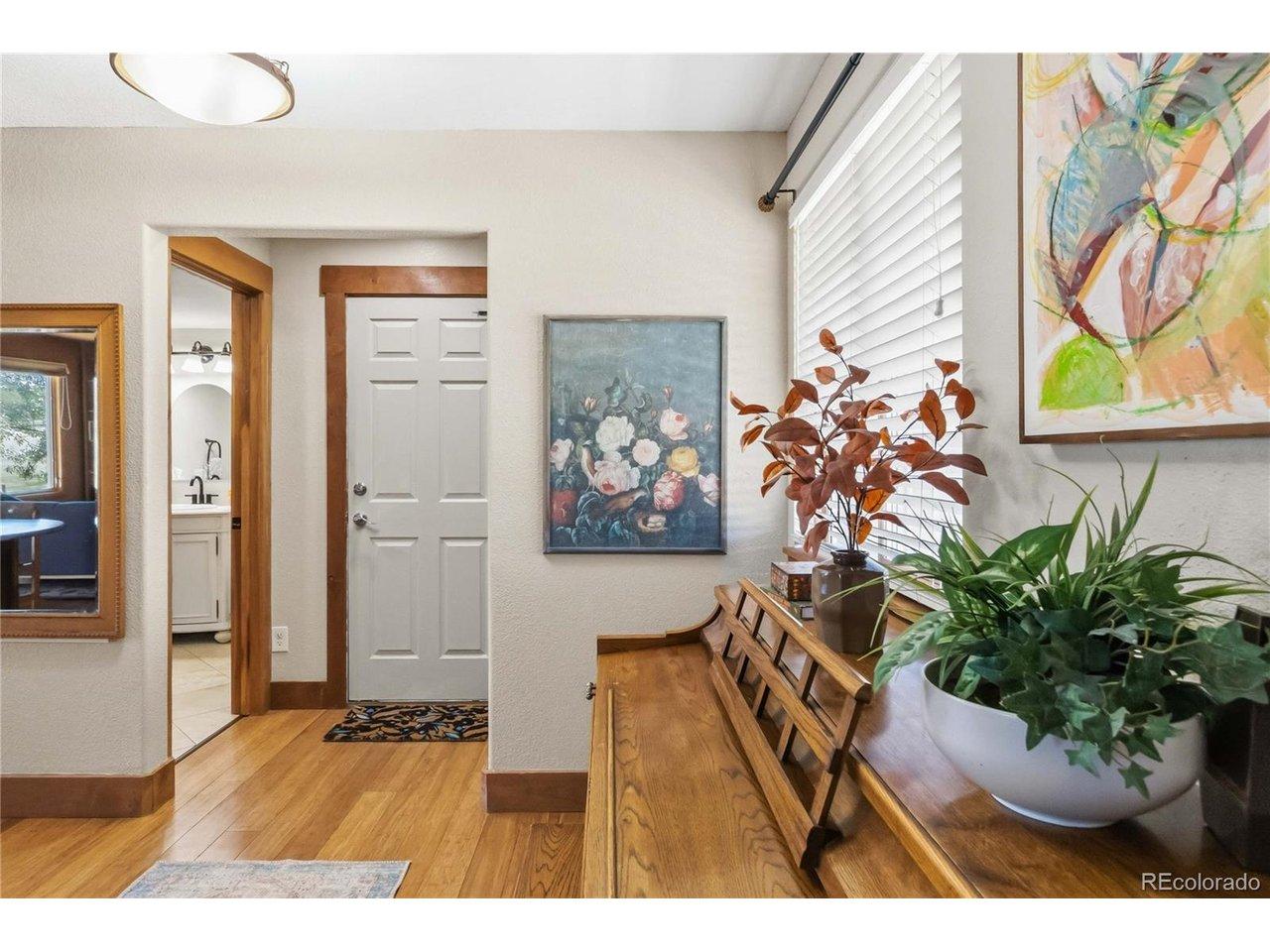Image 4: The entryway leads to the garage and a powder room on the main level.