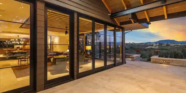Image 2: Seamlessly blending indoor and outdoor living, expansive sliding glass doors open to a spectacular covered terrace where breathtaking Rocky Mountain views create the perfect backdrop for entertaining or relaxing year-round. Image 2: Seamlessly blending indoor and outdoor living, expansive sliding glass doors open to a spectacular covered terrace where breathtaking Rocky Mountain views create the perfect backdrop for entertaining or relaxing year-round.