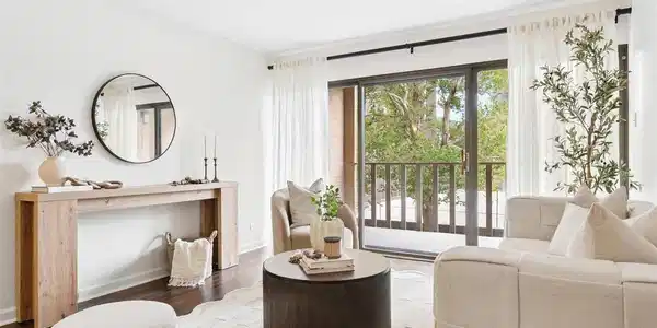 Image 2: Large windows bring natural light and surrounding greenery into the living space Image 2: Large windows bring natural light and surrounding greenery into the living space