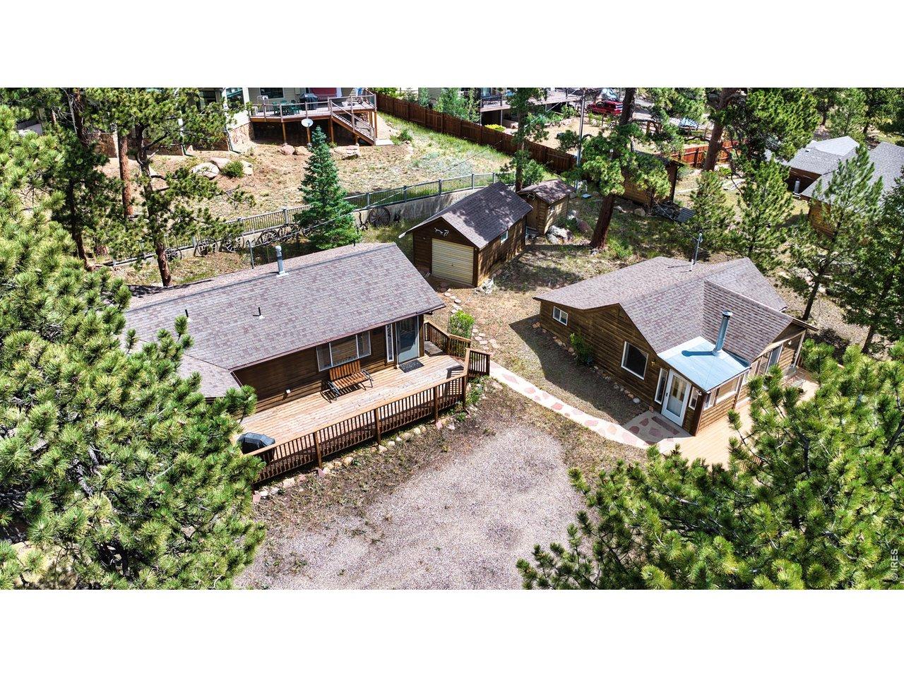 Image 3: Delightful mountain property featuring a main cabin and separate guest cabin on a spacious, tree-filled lot. Enjoy expansive decks, ample parking, detached storage, and a peaceful setting surrounded by mature pines. Ideal as a full-time residence. Image 3: Delightful mountain property featuring a main cabin and separate guest cabin on a spacious, tree-filled lot. Enjoy expansive decks, ample parking, detached storage, and a peaceful setting surrounded by mature pines. Ideal as a full-time residence.