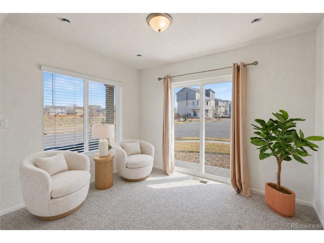 Image 2: First floor den, leading to outdoor space; Virtually Staged Image 2: First floor den, leading to outdoor space; Virtually Staged