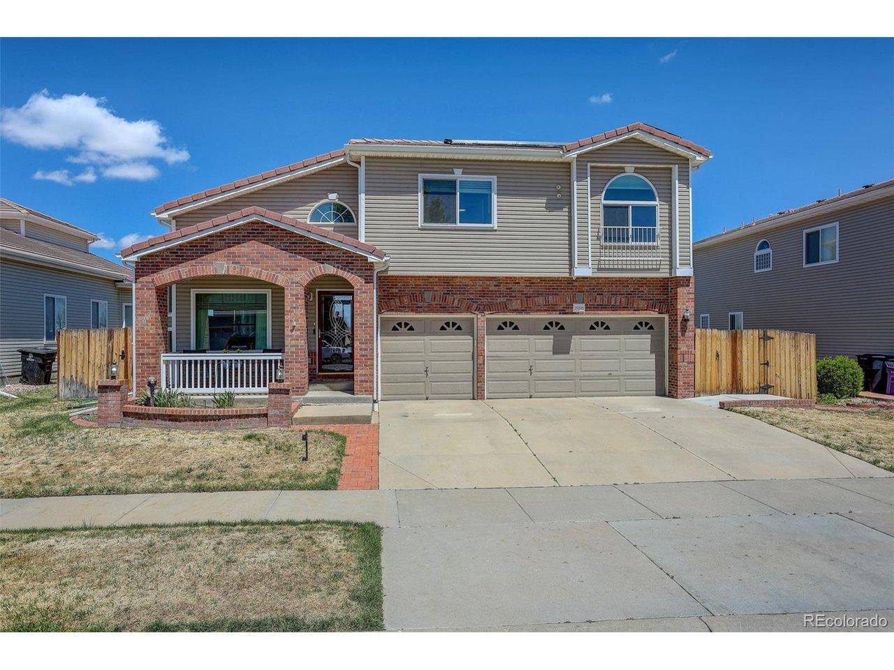 Image 2: Front of home featuring covered porch and garden area. Solar Panels installed on south-east portion of the roof. Solar system is paid in full.